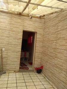 a corner of a room with a brick wall at Santo Ivo 2 in Aparecida