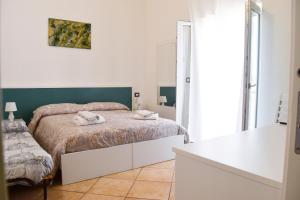 Posteľ alebo postele v izbe v ubytovaní Bed & Breakfast Domus Pepe Scalea