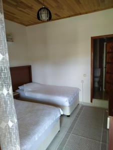 Postel nebo postele na pokoji v ubytování Olympos Yavuz Hotel