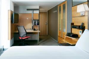 Tempat tidur dalam kamar di The Jewel Hotel, New York