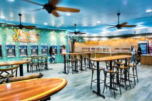 a bar with tables and stools in a restaurant at Circus Circus Reno Hotel Casino at THE ROW in Reno