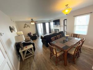 a living room with a table and a couch at Cape Coddages I 103 Condo in Myrtle Beach