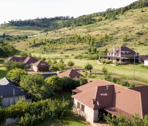 an aerial view of a farm with a house at Walkersons Trout and Nature Haven in Dullstroom