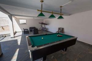 a living room with a pool table in it at One-Bedroom Apartment in Crikvenica XXXI in Dramalj