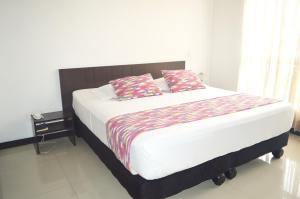 Postel nebo postele na pokoji v ubytování Hotel Mare Apartasuite