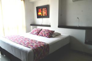 Postel nebo postele na pokoji v ubytování Hotel Mare Apartasuite