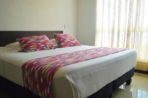Postel nebo postele na pokoji v ubytování Hotel Mare Apartasuite