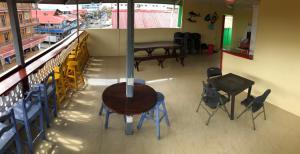 an overhead view of a restaurant with a table and chairs at REFF HOTEL in Bocas Town