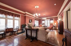 a living room with a couch and a table at Stone Soup Inn in Indianapolis