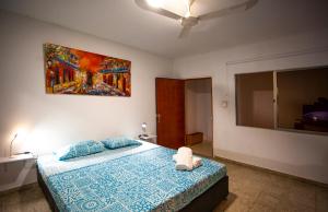 Postel nebo postele na pokoji v ubytování Hostal El Bando
