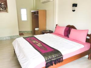 Postel nebo postele na pokoji v ubytování Discovery House Hotel SHA Plus