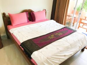 Postel nebo postele na pokoji v ubytování Discovery House Hotel SHA Plus