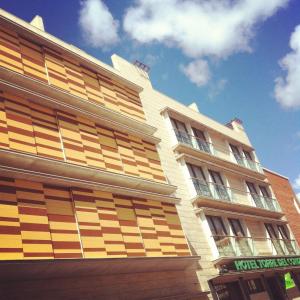 a building with wooden panels on the side of it at Hotel Torre Del Conde in San Sebastián de la Gomera