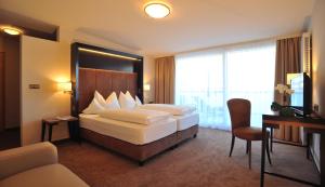 Ein Bett oder Betten in einem Zimmer der Unterkunft Hotel Goldene Rose