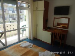 Postel nebo postele na pokoji v ubytování Saint George Family Hotel