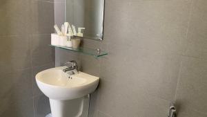 a bathroom with a sink and a mirror at Moonlight House & Apartment Nha Trang in Nha Trang