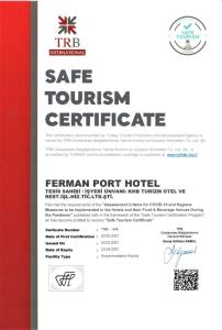 a permit for a safe tourism certificate on a red wall at Ferman Port Hotel - Special Category in Istanbul
