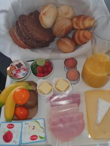 
a table topped with a variety of food items at Bed and Breakfast Katwijk in Katwijk aan Zee
