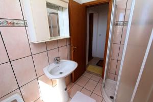 a bathroom with a sink and a shower at Apartment Monika in Rovinj +13 photos