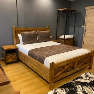 A bed or beds in a room at Zengin City Hotel