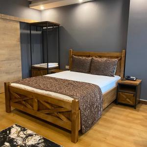 a bedroom with a large bed and two night stands at Zengin City Hotel in Istanbul