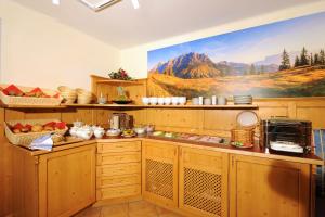 A kitchen or kitchenette at Aparthotel Kristall