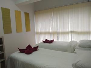 Postel nebo postele na pokoji v ubytování Avatara condo A63 by malai