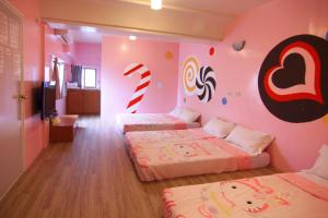 A bed or beds in a room at Hai Zhi Dao Min Su