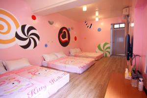 A bed or beds in a room at Hai Zhi Dao Min Su