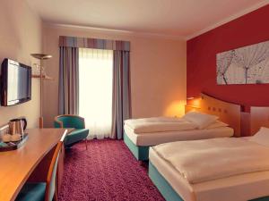 Säng eller sängar i ett rum på Mercure Hotel Ingolstadt