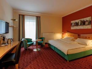 Postel nebo postele na pokoji v ubytování Mercure Hotel Ingolstadt