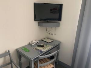 TV a/nebo společenská místnost v ubytování Auberge Champenoise