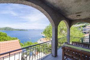 a balcony with a view of the water at Apartments Vitorin in Sobra