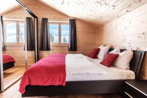 מיטה או מיטות בחדר ב-Heidi Chalets Falkert Heidialm - Chalets Bergwinter