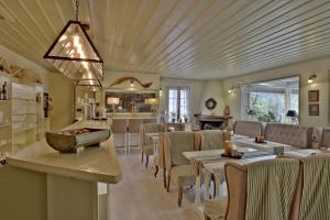 a restaurant with tables and chairs and a bar at Boutique Hotel Skamnos Arachova in Arachova