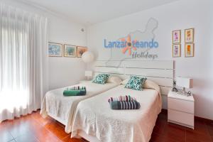 Posteľ alebo postele v izbe v ubytovaní Vivienda Vacacional Los Molinos 6205 firs floor apt