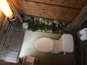 an overhead view of a toilet and some rocks at GranGlam - Vacation STAY 24973v in Susaki