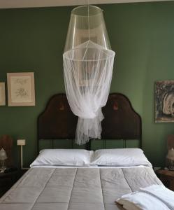 Postel nebo postele na pokoji v ubytování B&B LaMaGia di Corte Moronati