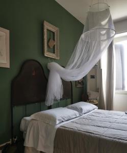 Postel nebo postele na pokoji v ubytování B&B LaMaGia di Corte Moronati