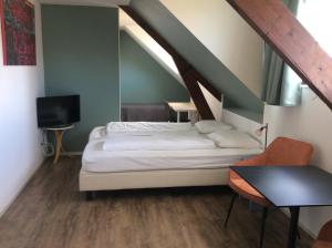 מיטה או מיטות בחדר ב-BergOpwaerts