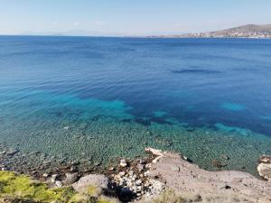 an aerial view of the water in the ocean at Ithaca in Perdika