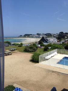 a view of a patio and a swimming pool at BELLE VUE MER STUDIO PISCINE in Trévou-Tréguignec