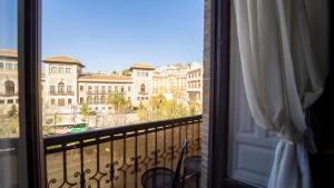 a balcony with a view of a building at Itinere Rooms in Granada