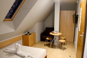 Posteľ alebo postele v izbe v ubytovaní Apartamenty Suzyw Pilsko