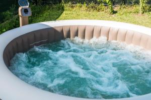 a jacuzzi tub filled with blue water at Il Rifugio di Amelia in Arezzo