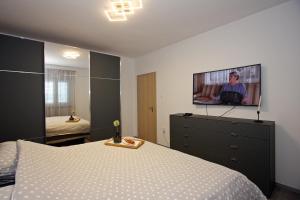 Posteľ alebo postele v izbe v ubytovaní Apartment Petra