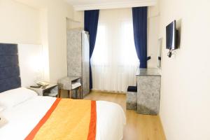 Postel nebo postele na pokoji v ubytování Hotel Yakut