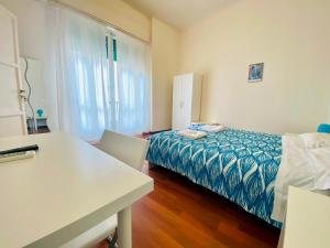 A bed or beds in a room at Castelnuovo Rooms #Politeama