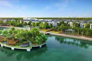 - une vue aérienne sur une rivière avec des maisons dans l'établissement 2 Bedrooms in luxury @Vinhomes Green Bay Ha Noi., à Hanoï