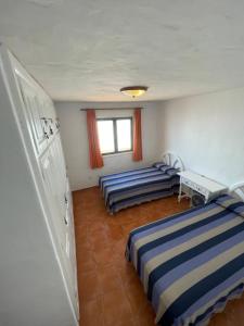 Łóżko lub łóżka w pokoju w obiekcie Villa Caleton